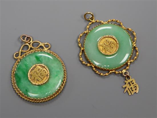 Two Chinese yellow metal mounted jadeite pendants, approx. 36mm.